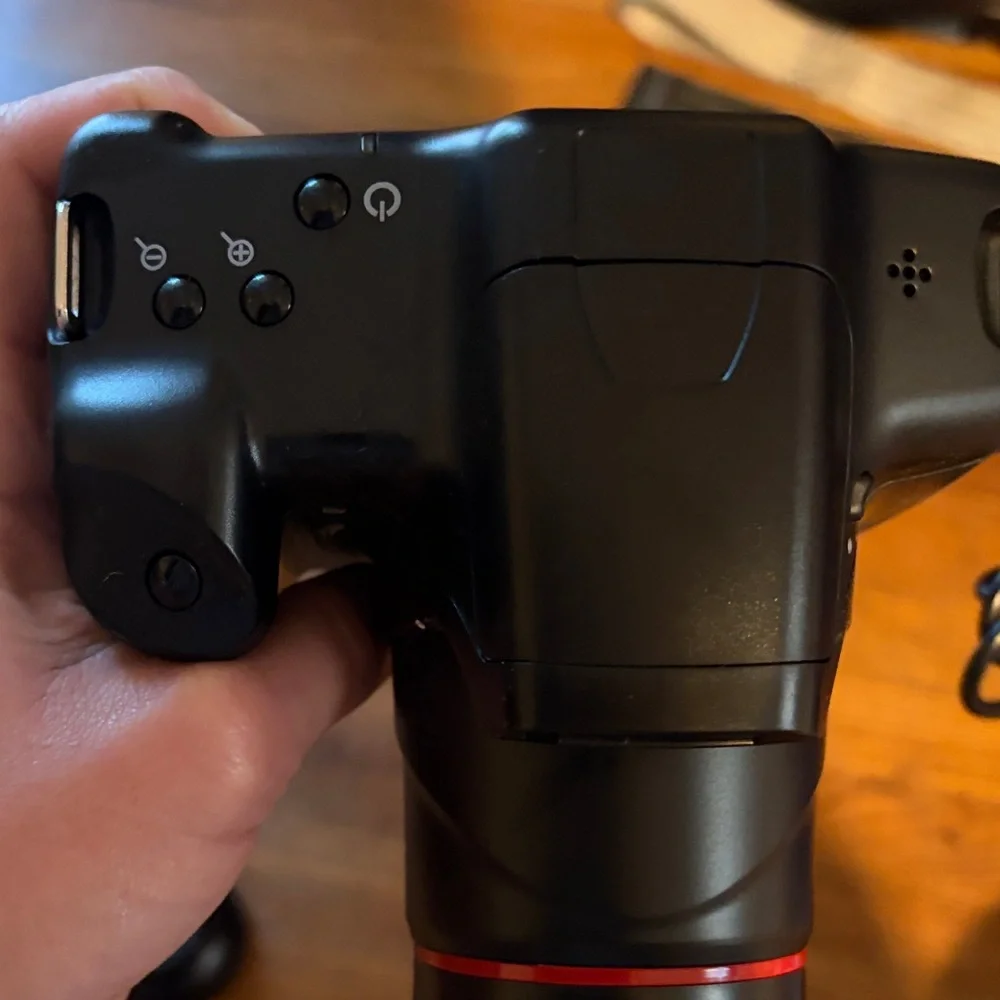 Black Compact Digital Camera with Lens Cap and SD Card